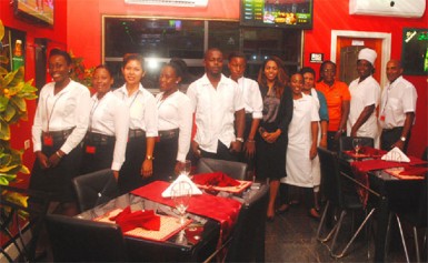 At the ready: Staff of the newly opened Midtown Chariot Hotel and Resturant on duty on Tuesday evening