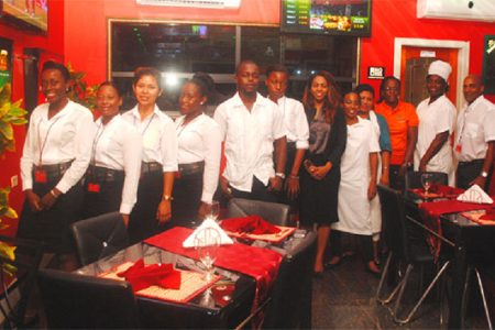 At the ready: Staff of the newly opened Midtown Chariot Hotel and Resturant on duty on Tuesday evening