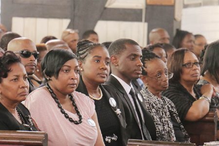 (From left) Lawrence Williams’s widow Valerie, his children and relatives at his funeral service yesterday at the St George’s Cathedral. (Photo by Arian Browne)
