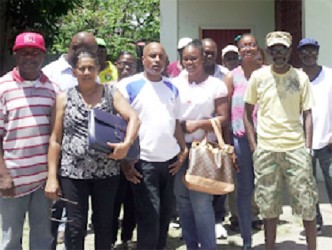 The workers standing in the yard of the union after they said they were barred from entering the conference.  