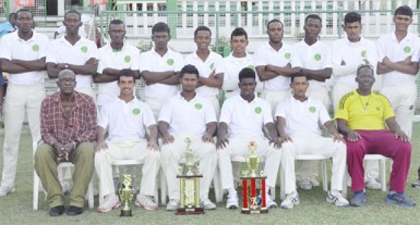 A victorious Demerara team pose with manager Robert “Pacer” Adonis (left front row sitting) and Coach Garvin Nedd (far right front row sitting) 