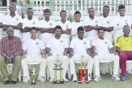 A victorious Demerara team pose with manager Robert “Pacer” Adonis (left front row sitting) and Coach Garvin Nedd (far right front row sitting)
