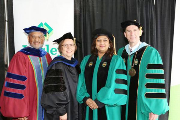 Minister of Education Priya Manickchand (second from right) was conferred an honorary doctoral degree by Lesley University on Saturday last for her work in advocating for social justice and gender equality, a release from the Ministry of Education said yesterday. A citation from Lesley Univer-sity stated that: “Priya Manickchand, your life has been dedicated to improving the lives of women, children, and families within your country.  You have been a tireless advocate for the victims of violence and a spokesperson addressing the cultural and human conditions that give rise to the pervasive problem of gender-based violence….”