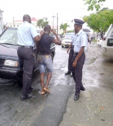 Steve Bacchus after he was captured yesterday on Brickdam.