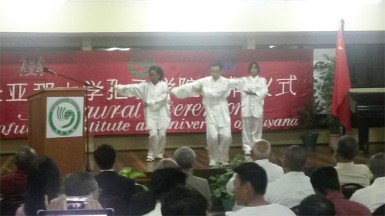 Instructor (centre) and students in a Tai Chi demonstration during the ceremony last night 