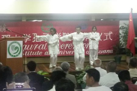 Instructor (centre) and students in a Tai Chi demonstration during the ceremony last night
