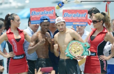 Jhonny Gonzalez and Clive Atwell pose off after making weight yesterday. 