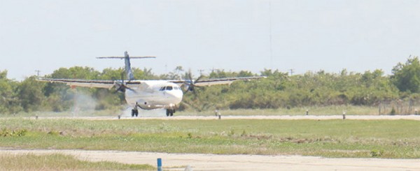 Touchdown: The LIAT ATR72 touched down yesterday at the Ogle International Airport in Guyana for the first time. It is the largest passenger commercial plane to date to land at the airport. The aircraft, which can accommodate 68 persons, brought 44 passengers yesterday to Guyana. Ogle Airport Inc representative Kit Nascimento said that the company was pleased that the airport, whose certification has been upped to a Code C Airport, can now accommodate large aircrafts like the ATR72. (Photo by Arian Browne)                                                                                                                                                                                                                                                                                                                                                                                                                                                                     