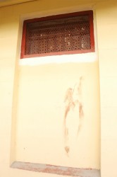 The now reinforce ventilation window that four prisoners managed to fit through in a desperate bid to secure their freedom. One was killed while two have been recaptured alive. Bloodstains are evident on the wall. From all indications one of them sustained an injury while climbing out. 