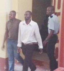 Wesley Morrison (R) and Royston Herod (L) being escorted to the holding cells 