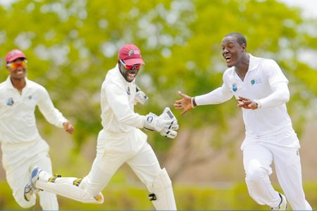 Sagicor WI HPC captain Kraigg Brathwaite, left, wicketkeeper Chadwick Walton and seamer Carlos Brathgwaite, right celebrate another Bangladesh A wicket on the second day of the first four day match between the two sides at the Windward Sports Club. (Photo by WICB media/Randy Brooks of Brooks/La Touche photography.
