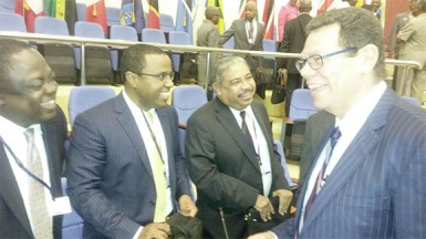 CDB President Dr Warren Smith (right) speaking to delegates yesterday. 