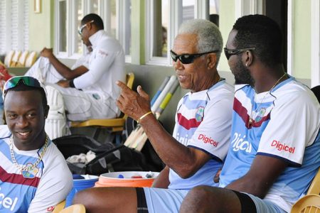 Sir Garfield Sobers speaks to Kemar Roach and Sulieman Benn during a training session for the West Indies team at the 3Ws Oval at the Cave Hill Campus of the University of the West Indies in Barbados earlier this week. (Photo WICB Media Philip Spooner)
