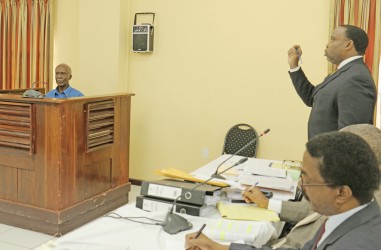 Keith Scotland, one of the attorneys appearing at the Rodney Commission of Inquiry yesterday questioning Eddie Rodney, one of the brothers of the slain historian, Walter Rodney as the hearings continue at the Supreme Court law library.