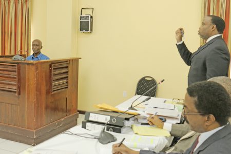 Keith Scotland, one of the attorneys appearing at the Rodney Commission of Inquiry yesterday questioning Eddie Rodney, one of the brothers of the slain historian, Walter Rodney as the hearings continue at the Supreme Court law library.