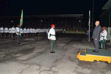 President Donald Ramotar (right) taking the salute from the Guard of Honour at the 48th Independence celebrations at the National Park last night. (GINA photo)