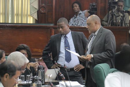 Speaker of the National Assembly Raphael Trotman (right) speaking to AFC MPs yesterday in the National Assembly.