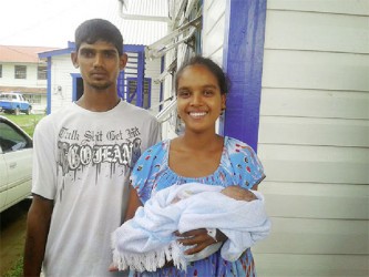 Reunited: Sandra McLean, 22, called ‘Pinky’ of No. 60 Village, Corentyne and Ravikan Bistonauth reunited with their child.