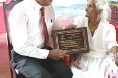 Sogaree Jattan, pictured in 2008, receiving the Citizens for a Better Trinidad and Tobago’s Republic Day award in 2008, from his president Harrack Balramsingh, who also died recently.
