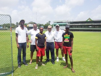  Baltimore Orioles director Fred Ferreira (third from right) and GBL President Robin Singh (second from left) with local baseball players 