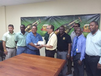 President of the GRFU receives a sponsorship cheque from Brian Choo-Hen, Brand Manager of Banks Beer.  