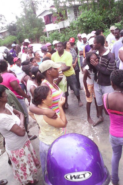 The chaotic scene in front of the Sams’ residence when the bodies were discovered  