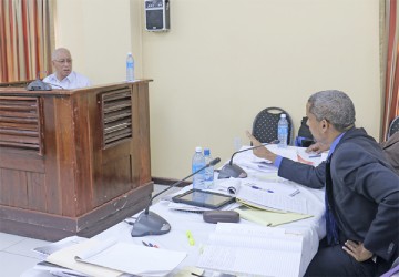 Former Guyana Defence Force Chief of Staff Norman McLean being cross-examined during yesterday’s proceedings by Barbadian lawyer Andrew Pilgrim who is representing the family of Dr Walter Rodney.