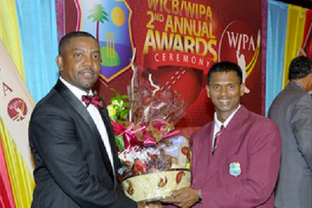  Shivnarine Chanderpaul receiving one of his awards from Jamaican Maurice Foster.