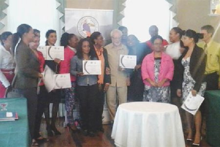 Participants pose with President of THAG Kit Nascimento and facilitators