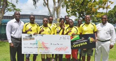 The Guyana team with Lee Baptiste, Guinness Brand Manager, Mortimer Stewart, Outdoor Events Manager of Banks DIH and Referee Wayne Griffith. 