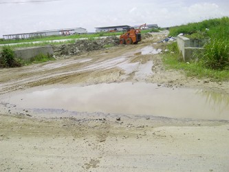 The slushy road that leads to businesses in the New Eccles Industrial Site.