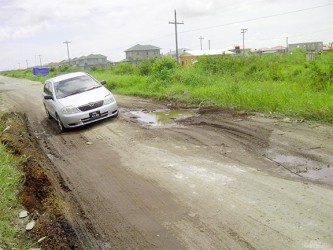 A typical pot hole on the main road to New Eccles Industrial Site