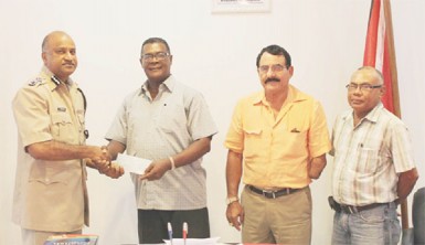 Making the presentation to acting Police Commissioner Seelall Persaud (left) on behalf of the GGDMA was the President of the Association, Patrick Harding (second from left) who was accompanied by Vice-President Charles Da Silva (third from left) and Executive Member Dabria Marcus. (Guyana Police Force photo)