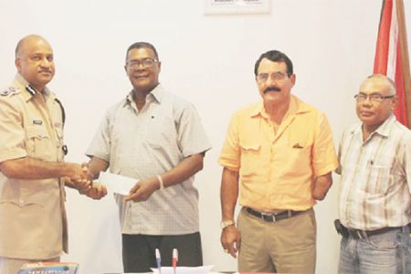 Making the presentation to acting Police Commissioner Seelall Persaud (left) on behalf of the GGDMA was the President of the Association, Patrick Harding (second from left) who was accompanied by Vice-President Charles Da Silva (third from left) and Executive Member Dabria Marcus. (Guyana Police Force photo)