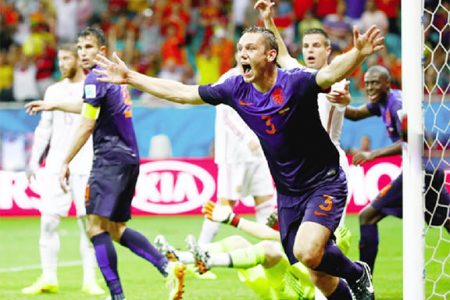 Stefan de Vrij of the Netherlands scores against Spain during their 2014 World Cup Group B match at the Fonte Nova arena in Salvador yesterday. REUTERS/Fabrizio Bensch 
