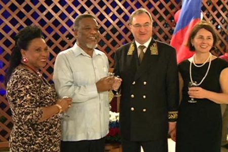 From left are Yvonne Hinds, Prime Minister Samuel Hinds, Russian Ambassador Nikolay Smirnov and his wife Tatiana Styablina toast at the Russia Day celebration. (GINA photo)
