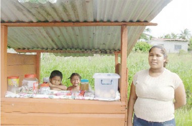 Street vendor, Althea Goocharan and her two children