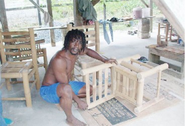 Craftsman and former community leader Michael Allen with one of his pieces