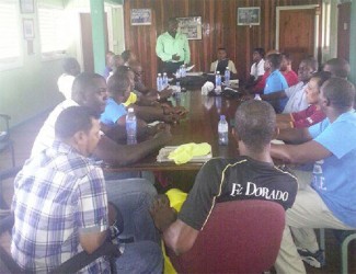 Colin Stuart (standing) makes a point during a meeting of GCB coaches