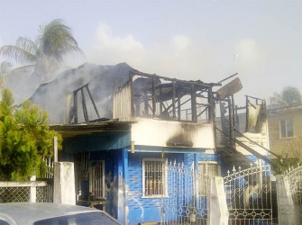 The Delph Street house still smoking yesterday after the fire was put out