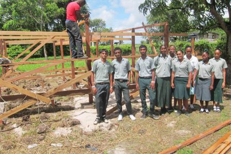 Students of the Diamond Special Needs School on the East Bank Demerara posing in front of the first shade house currently being built as a part of a hydroponic project in collaboration with Partners of the Americas. (Photo courtesy of Deaf Guyana)