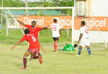 Dwayne Jeffrey of Queenstown Secondary celebrating after scoring one of his three goals during his side’s crushing win over Freeburg Secondary on Monday. (Orlando Charles photo) 