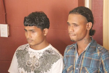 The two accused: Asaf Alli and Abdool Shazim Razack leaving the Georgetown Magistrates’ Courts shortly after their arraignment yesterday morning. 