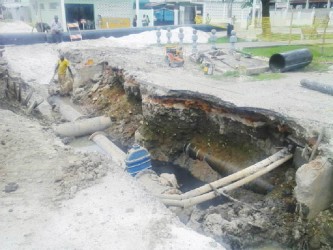 A GWI workman laying pipes at the Camp and New Market streets junction yesterday afternoon. 