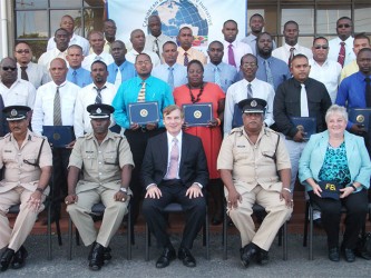 US Ambassador to Guyana Brent Hardt (centre) poses with the participants of the week-long courses along with high ranking officers, including Senior Superintendent Paul Williams (second left) and Assistant Commissioner Balram Persaud (second right)