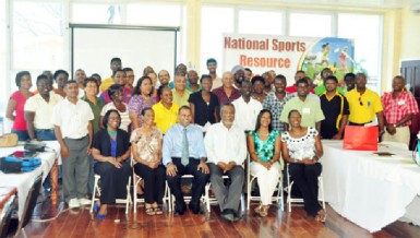 The 42 participants of the three-day Sports Management Workshop along with Prime Minister, Samuel Hinds, Minister of Sport, Frank Anthony, Cathy Samuels, Grace Jackson and June Rudder pose for a photo opportunity. (Orlando Charles photo)  