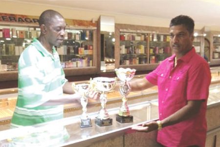 In the picture above, Corporal Linden Matthews, left receives the trophies from Steve Narine proprietor of Steve’s Jewellery.