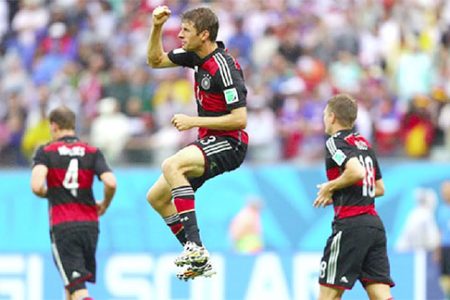 Thomas Mueller of Germany (C) celebrates scoring (FIFA photo)