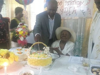 Lydia cutting the cake with her son Noel. 