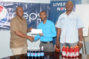 DDL’s Sales Manager Larry Wills shaking the hand of GBA’s president, Steve Ninvalle as Technical Director of the association, Terrence Poole looks on.